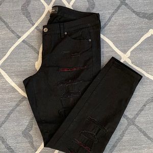 Black denim skinny jeans with flannel inserts from torrid